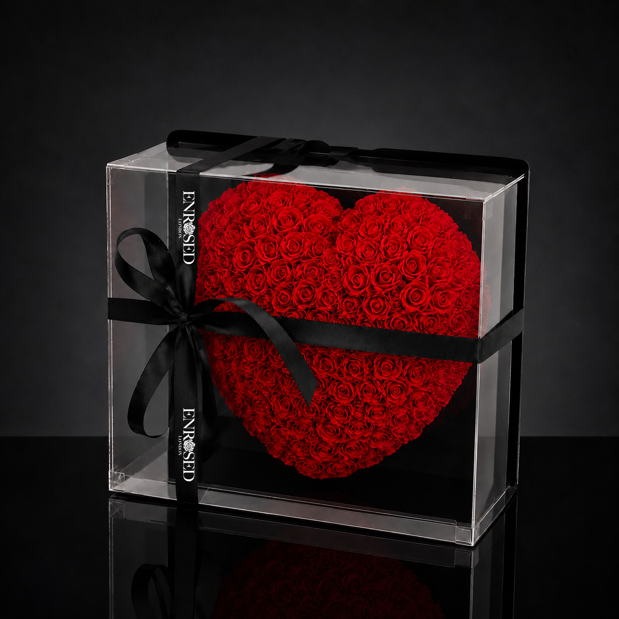 25 cm half-heart arrangement with red foam roses and black ENROSED LONDON ribbon