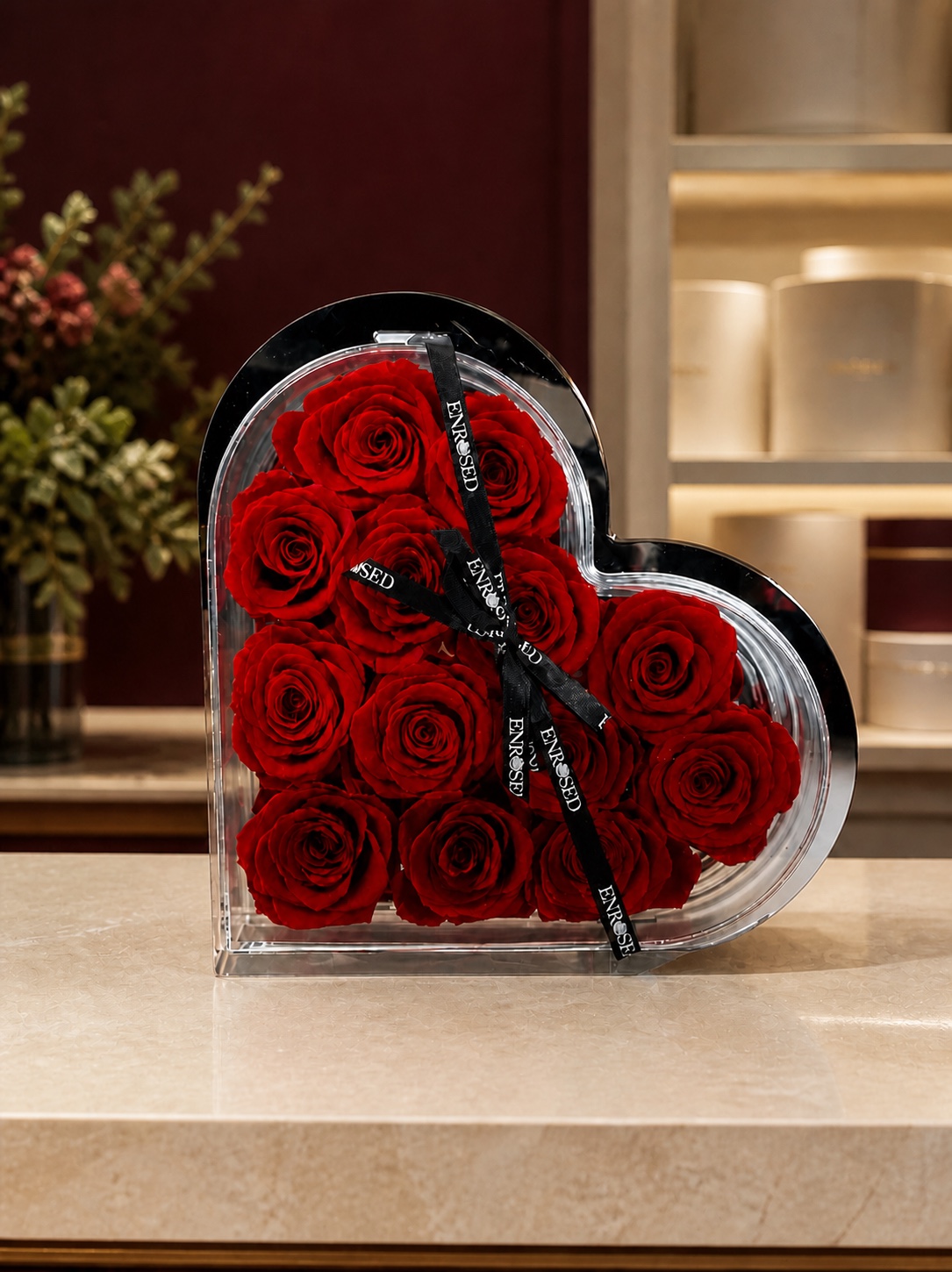 Heart-shaped mirror box with red preserved roses — in the Enrosed showroom